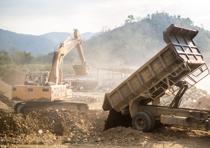 Photo of a heavy machinery at a quarry.